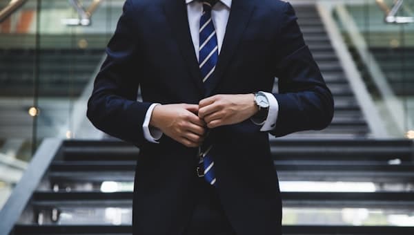 A professional considering figures at a desk