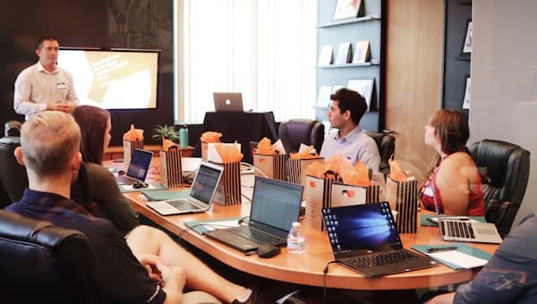 A manager giving feedback in a meeting
