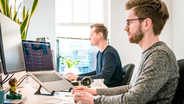 Developers collaborating at a desk
